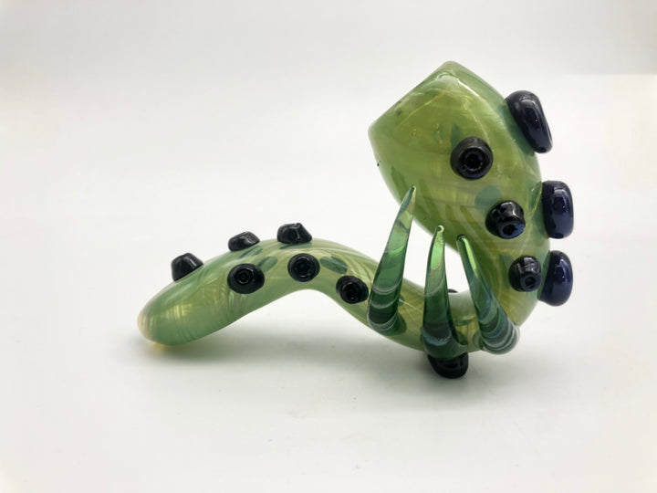 Curved glass pipe with embellished horns and dots